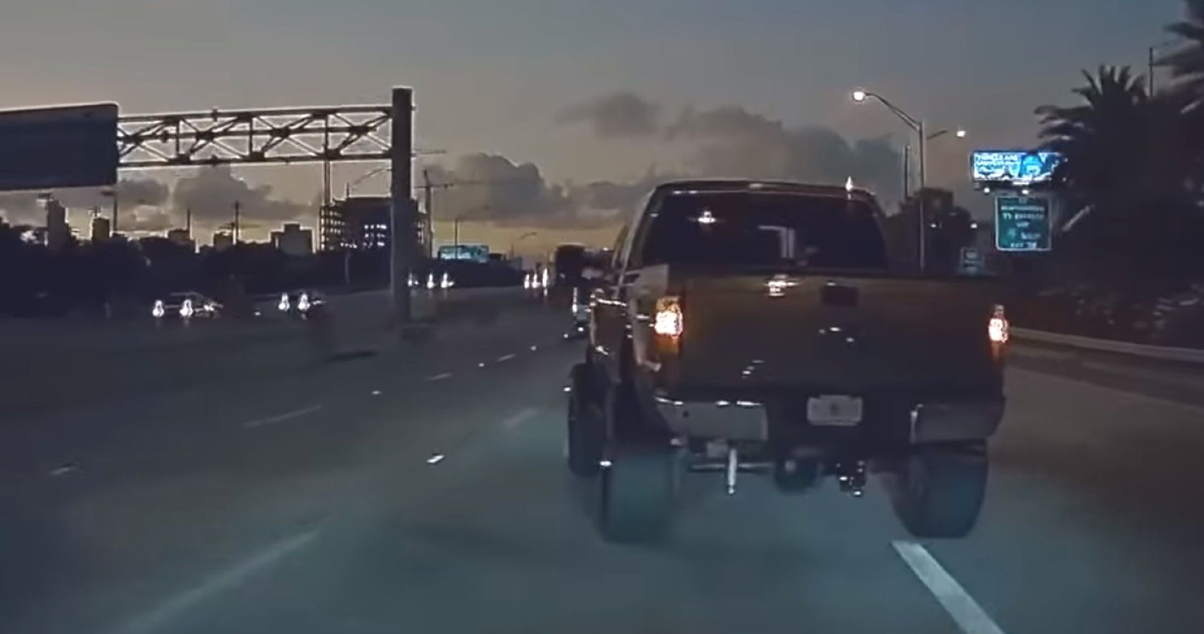 Watch Tesla Model 3 Get "Coal Rolled" By Angry Diesel Pickup